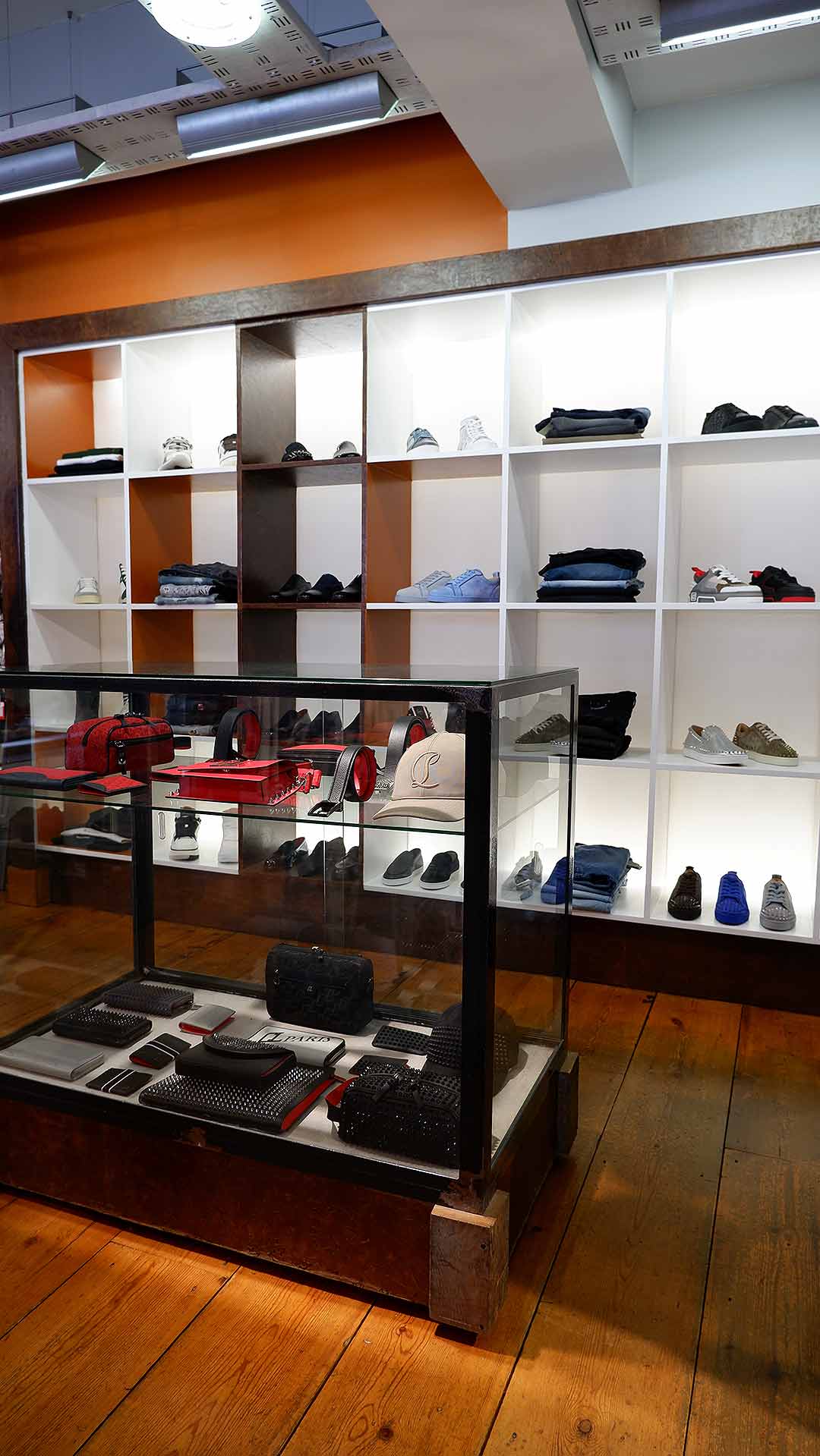 Zoo Fashions. Brick-and-mortar mens designer clothing store in Ilford Essex. Store Interior. Stockist of designer brands including Christian Louboutin. Styles such as Louis Junior, Astroloubi,  FAV shoes and wallet