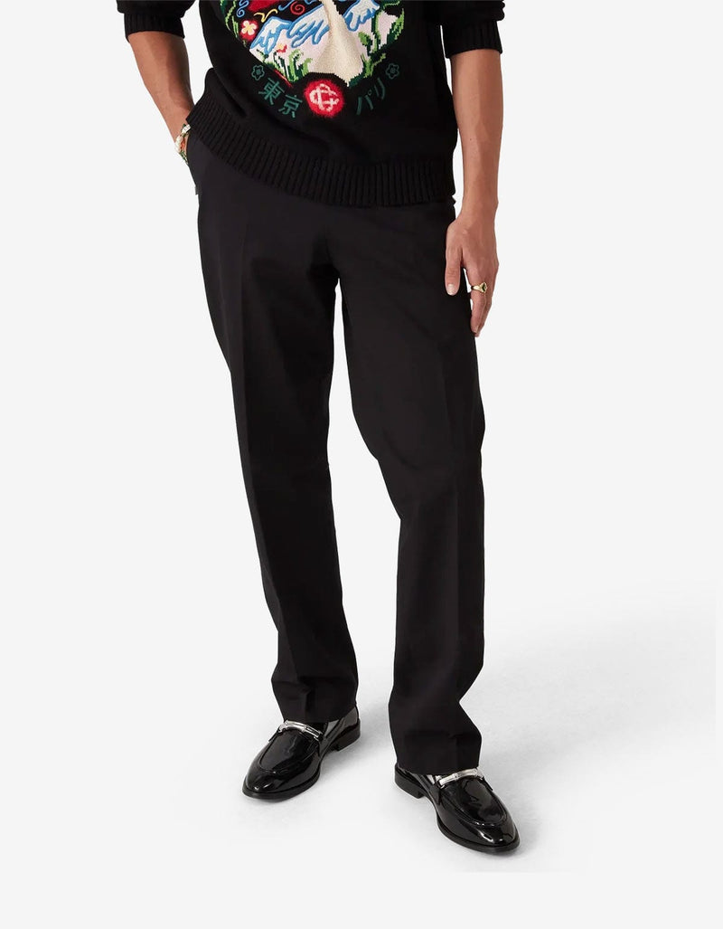 Casablanca Black Chino Trousers MPF25-TR-321-01. Model wearing a black sweater with colourful designs and black pants