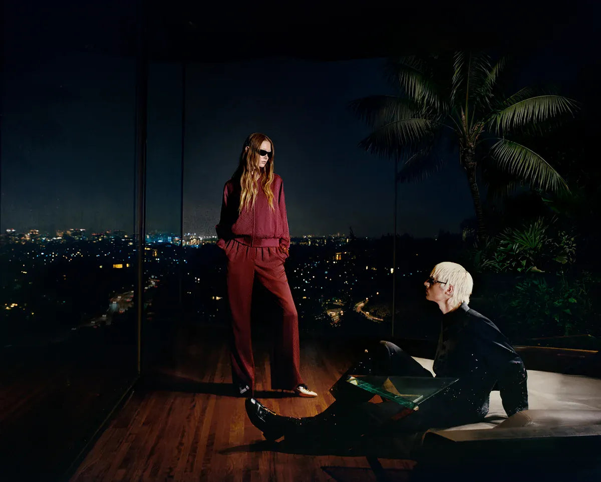 Casablanca SS26. Two people on a rooftop at night with city lights in the background