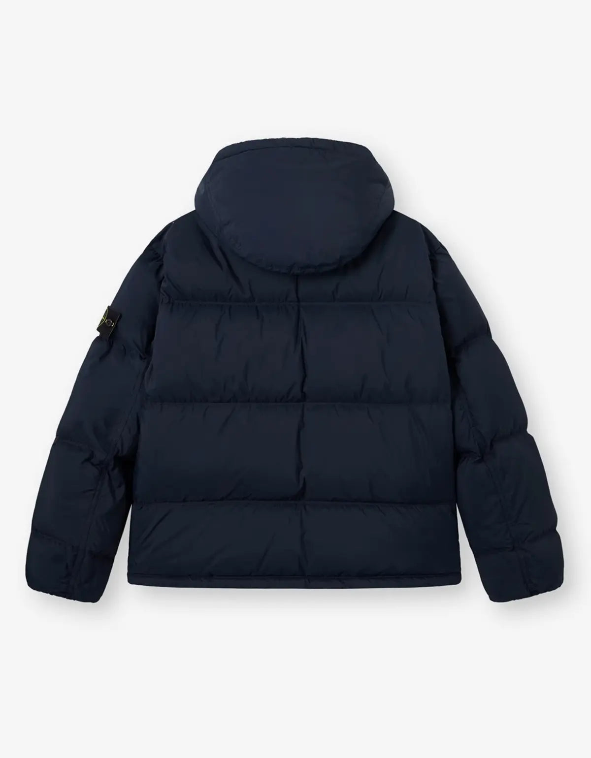 A navy blue hooded puffer jacket shown from the back, featuring horizontal quilting and a small black brand patch on the left sleeve, set against a plain light gray background.