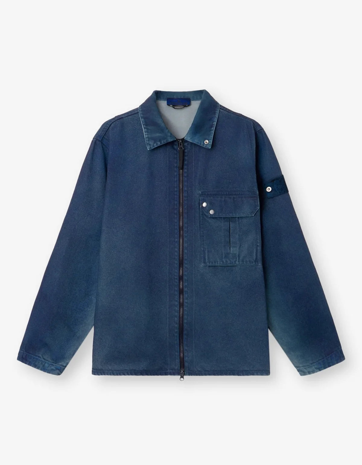 A dark blue denim work jacket with a zippered front, a chest pocket with snap buttons, and a sleeve patch, shown flat on a light gray background.