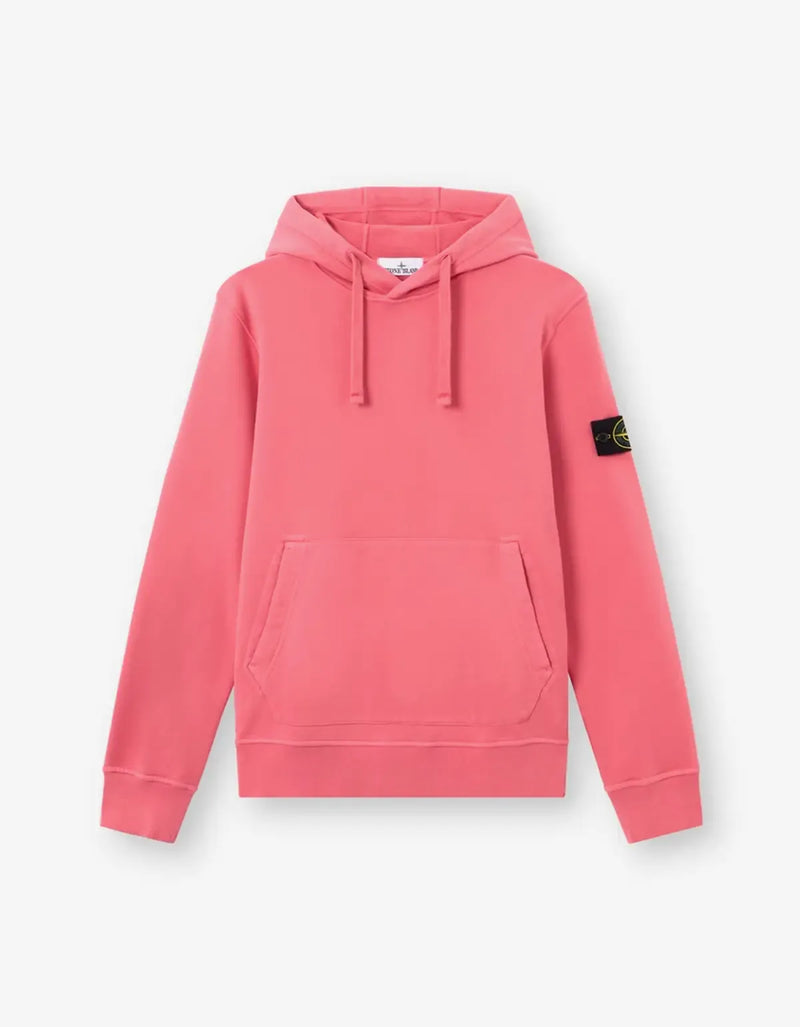 A pink Stone Island pullover hoodie with a drawstring hood, kangaroo pocket, and the signature compass patch on the left sleeve, shown against a light gray background.