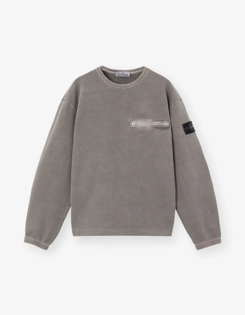 A gray crewneck sweatshirt with a zippered chest pocket and a black Stone Island brand patch on the left sleeve, displayed on a clean white background.