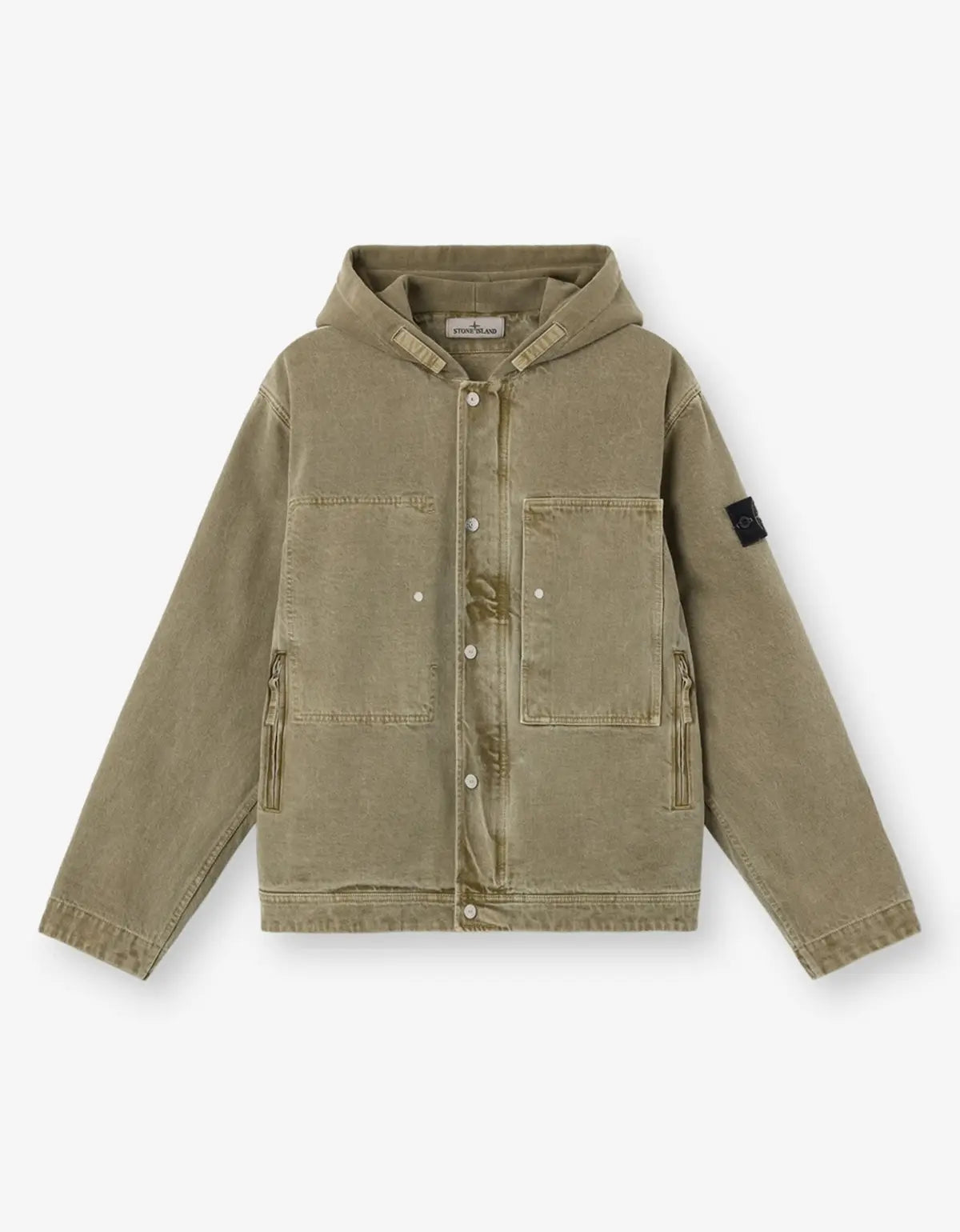A hooded utility jacket in a muted olive-khaki color, featuring a snap-button front, chest pockets, zippered hand pockets, and a black rectangular patch on the left sleeve, displayed on a clean white background.