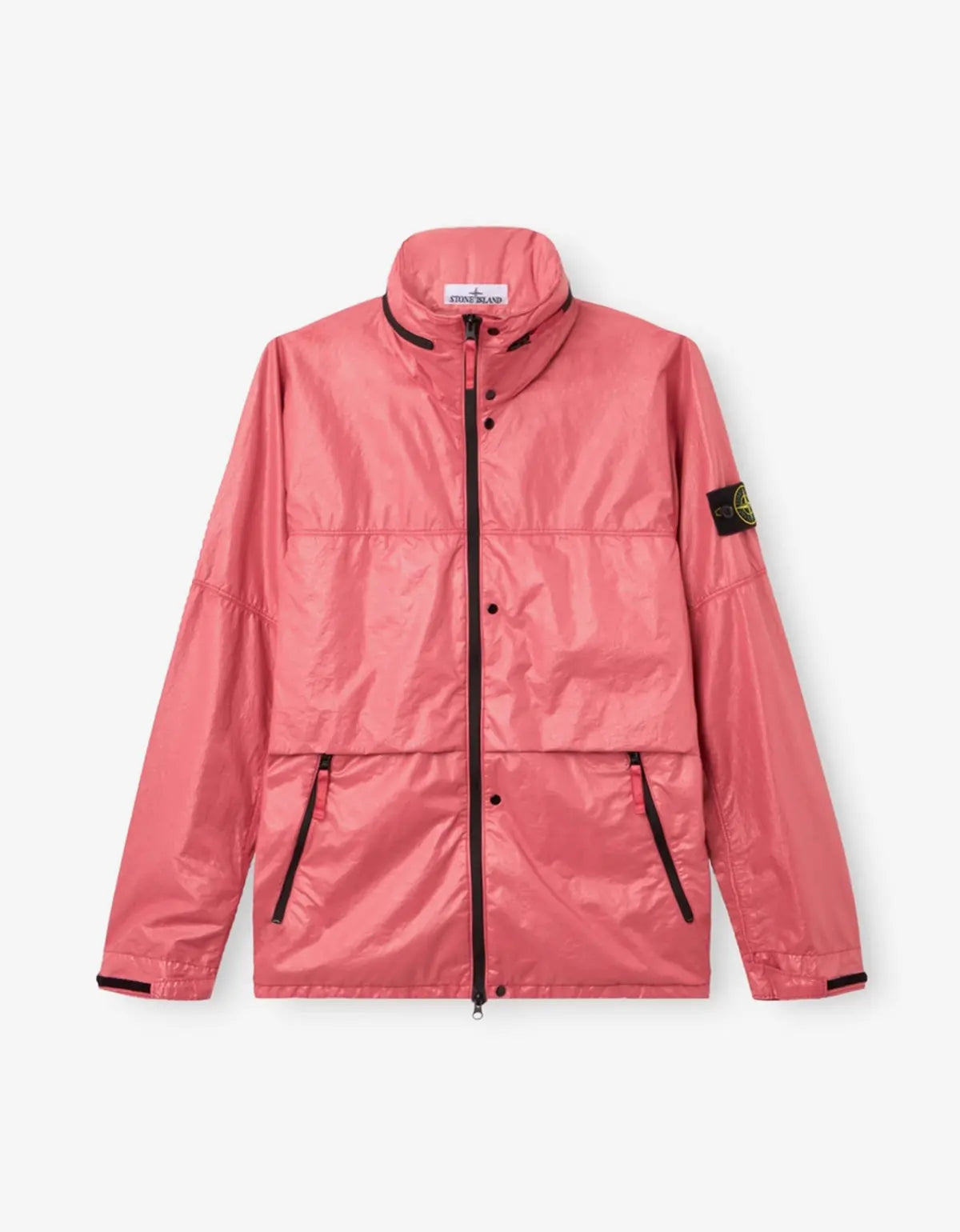 A pink lightweight waterproof jacket with black zipper details, a high collar, and the Stone Island compass patch on the left sleeve, shown against a light gray background.
