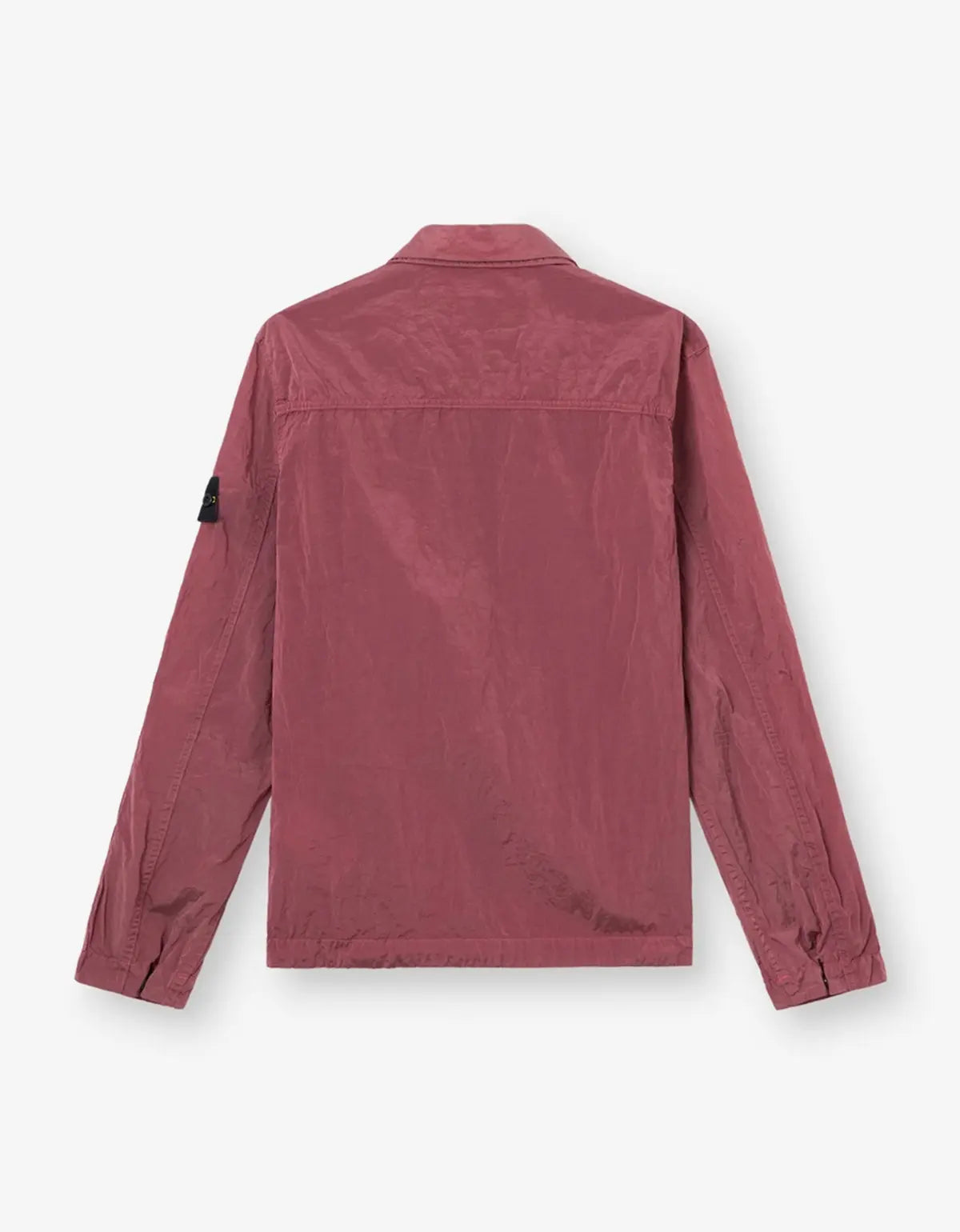 A dusty rose utility jacket shown from the back, featuring a collar, long sleeves, and a small black fabric tag on the left sleeve, set against a light gray background.