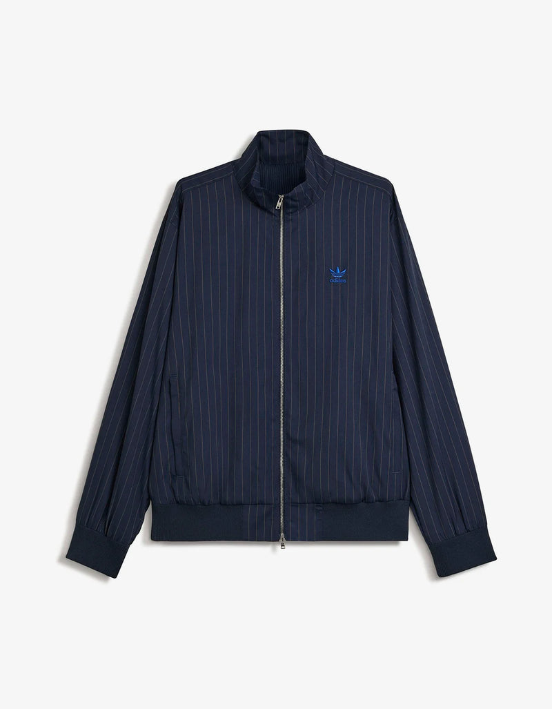 A navy blue pinstriped zip-up jacket with a small blue embroidered Adidas trefoil logo on the left chest, displayed against a light gray background.