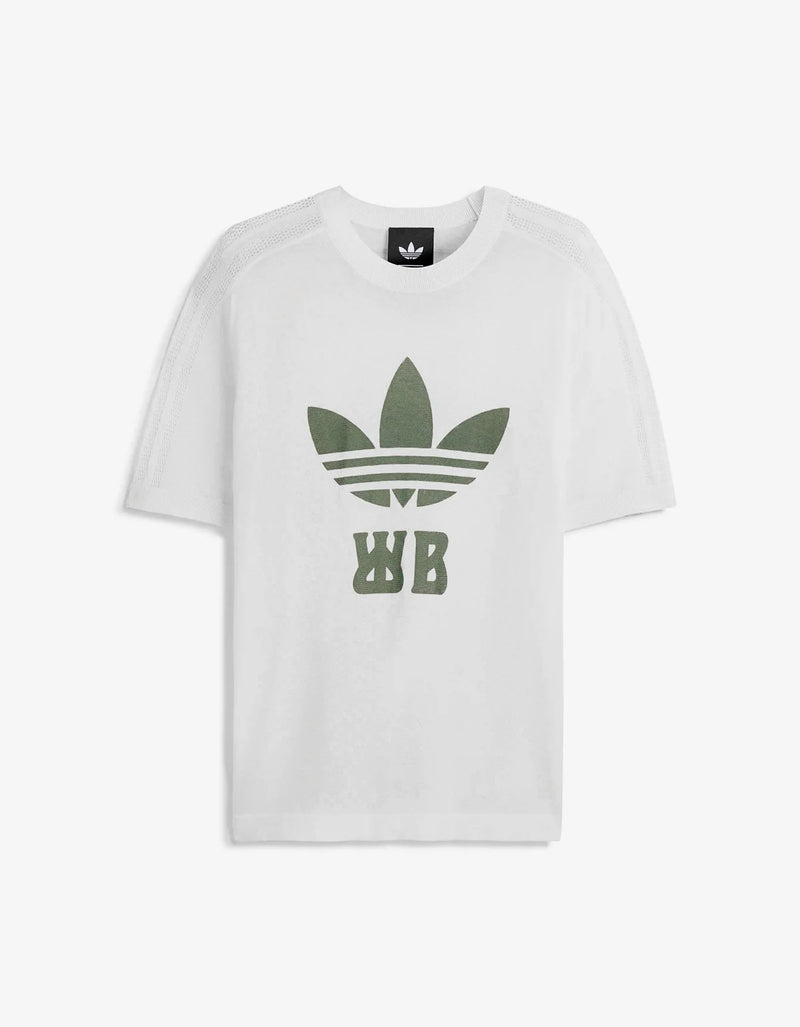 A white short-sleeve crewneck t-shirt featuring a large green Adidas Trefoil logo with 'WB' lettering on the front, displayed against a clean white background.