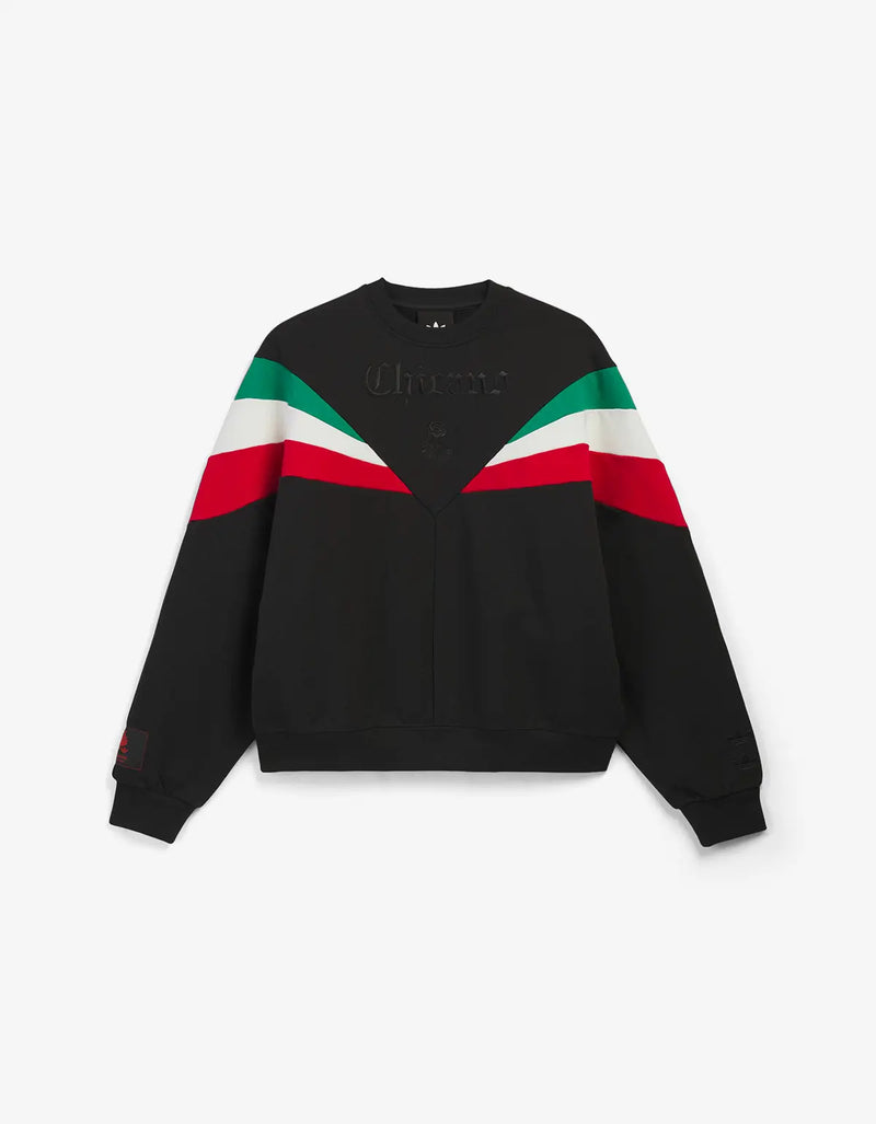 A black crewneck sweatshirt, featuring diagonal stripes in green, white, and red across the chest and shoulders. 'Chicano' is embroidered in black on the chest.
