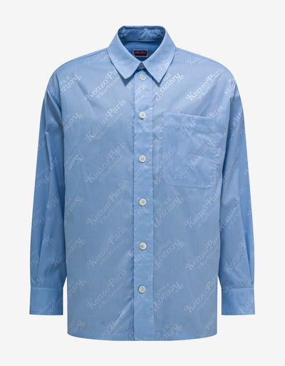 Kenzo 'Kenzo by Verdy' Blue All-Over Logo Overshirt.This oversize shirt is part of the collaboration between Nigo and Verdy. It features the iconic 'KENZO Paris 18 rue Vivienne' monogram printed all over the piece.