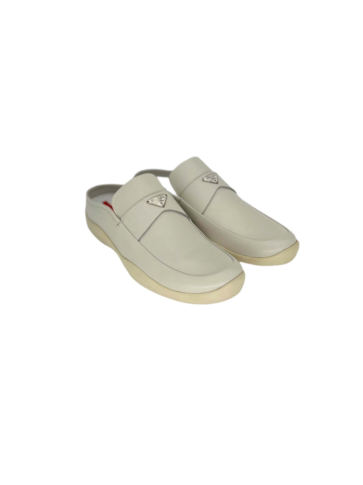 Prada Linea Rossa White Mules With Metal Logo